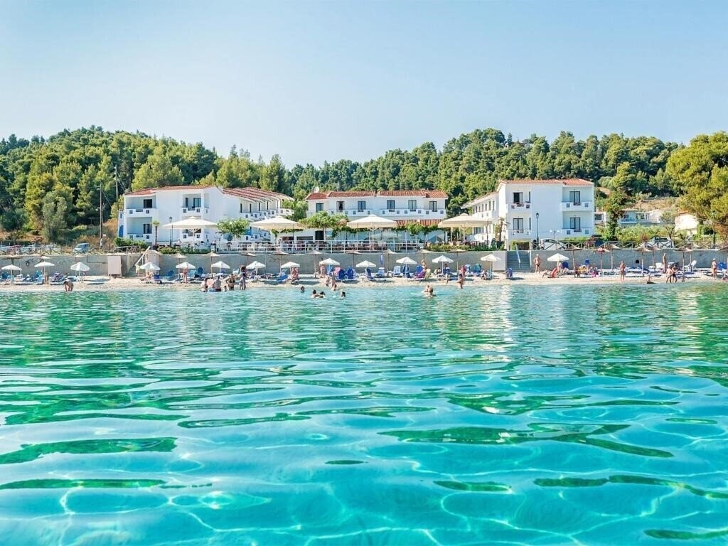 Отель Xenios Dolphin Beach 3*