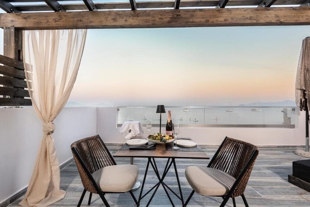 Фотография Kyma Rooms & Suites 3*