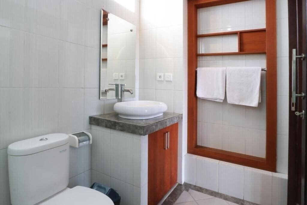 Фотография Kondra Premiere Guest House Kuta 3*