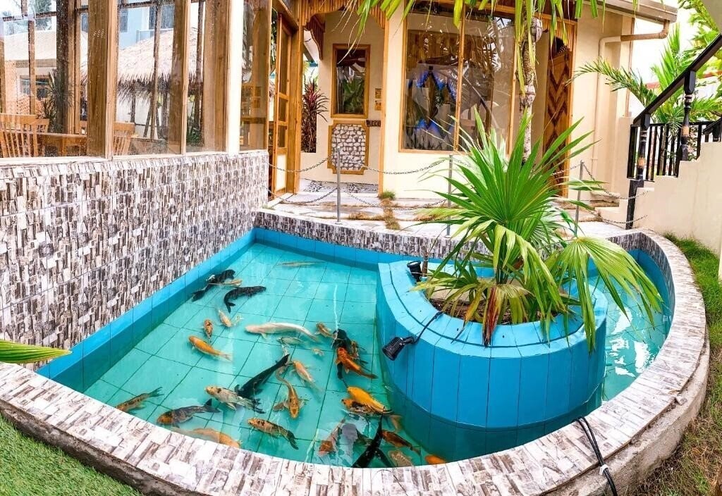 Картинка Manta Dhangethi Guest House коттедж