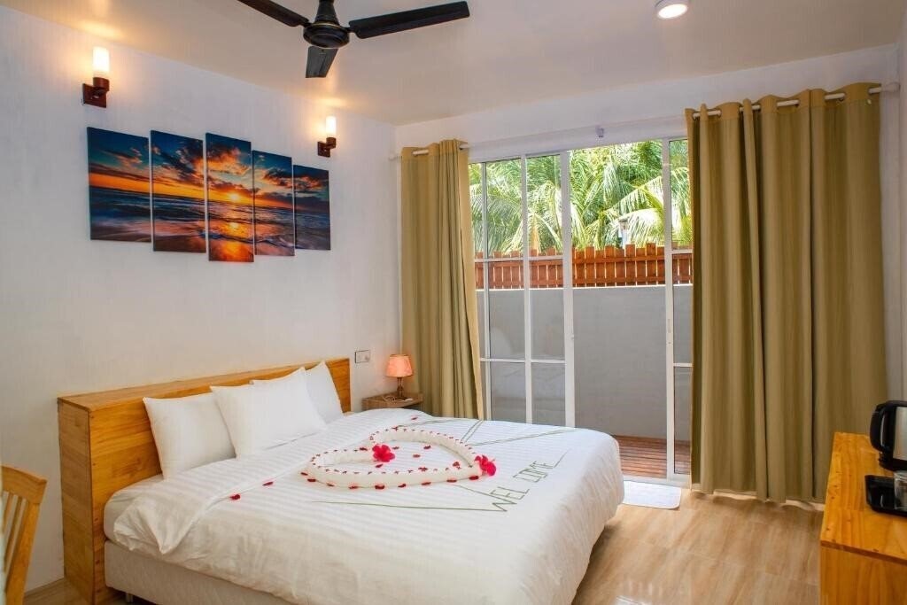 Отель Finolhu Inn Dhigurah Guest House гостиный двор