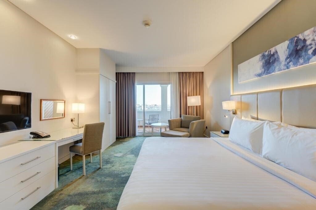 Фотография Millennium Lakeview Hotel Formerly Copthorne (ex. Copthorne Lakeview Hotel, Dubai Investment Park) 4*