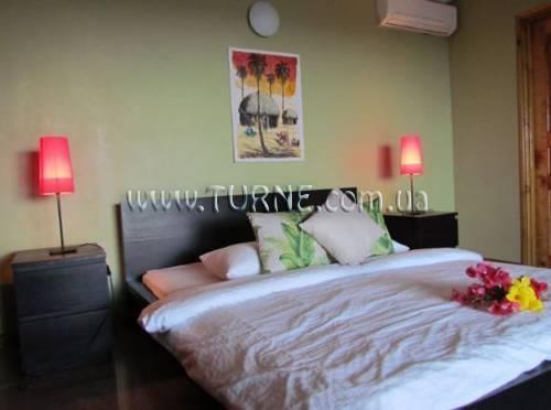 Отель Albizia Lodge Reef Estate 4*