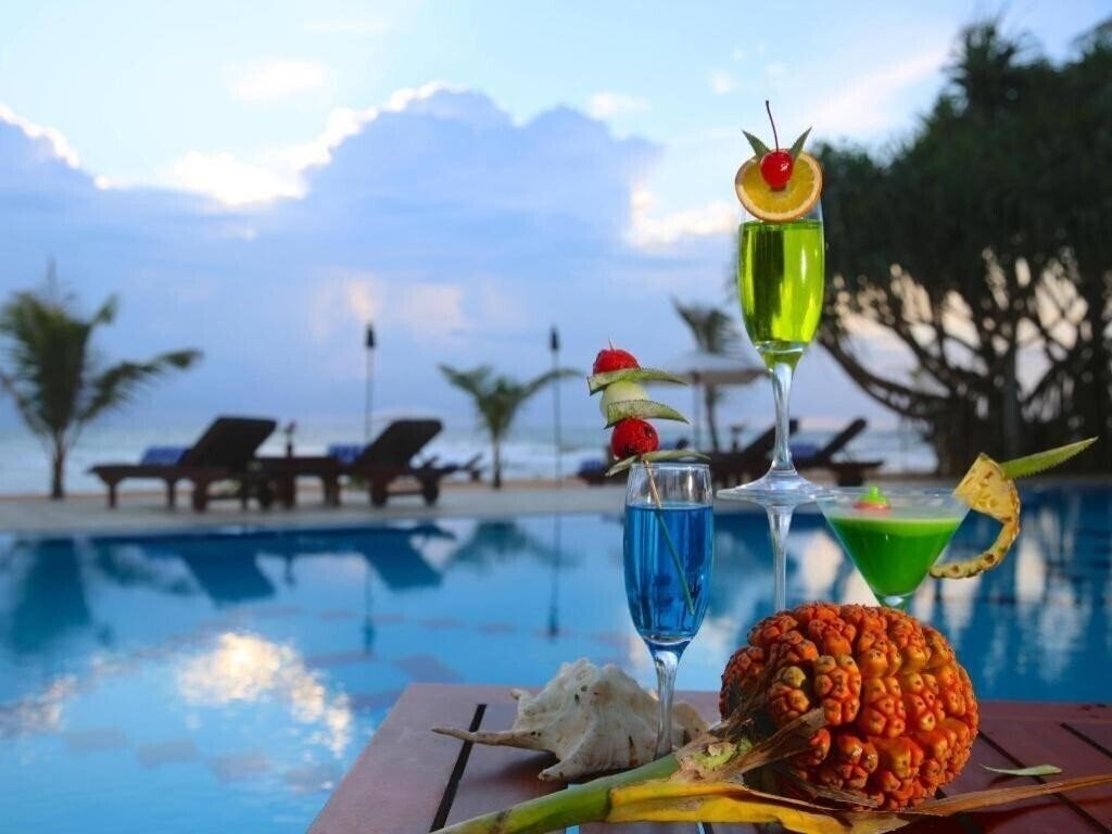 Фотография Whispering Palms 3*