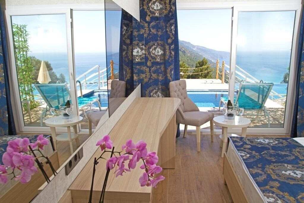 Фотография Sertil Deluxe Hotel & SPA (ex. Tropical Suites by Sertil, Ramada by Wyndham Fethiye Oludeniz) 4*